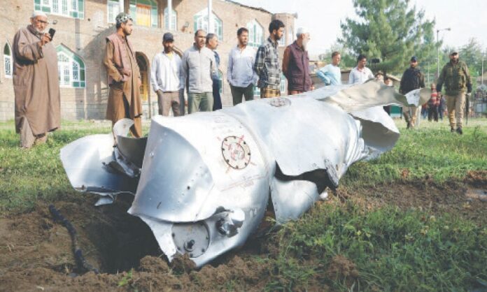 PULWAMA (India-held Kashmir): Metal debris of an Indian fighter plane lie on the ground in Wuyan.—Reuters PULWAMA (India-held Kashmir): Metal debris of an Indian fighter plane lie on the ground in Wuyan.—Reuters